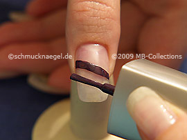 Nail lacquer in the colour dark purple