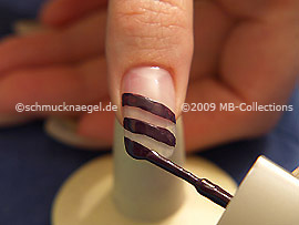 Nail lacquer in the colour dark purple