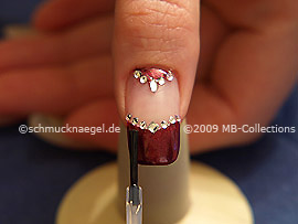 The clear nail lacquer protects the nail art