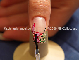 The clear nail lacquer protects the nail art