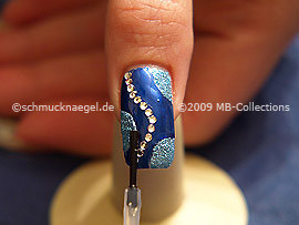 The clear nail lacquer protects the nail art