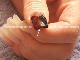 Nail polish in the colour dark-red-glitter