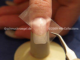 Clear adhesive tape and tweezers