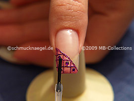 The clear nail lacquer protects the nail art