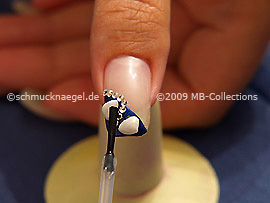 The clear nail lacquer protects the nail art