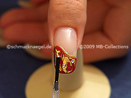 The clear nail lacquer protects the nail art