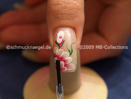 The clear nail lacquer protects the nail art