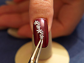 Nail art sticker and the tweezers