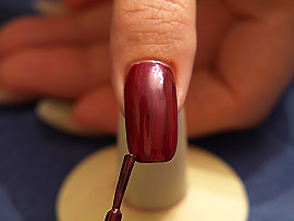 Nail lacquer in the colour aubergine