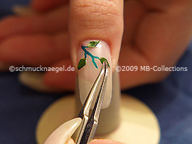 Dried leaf and the tweezers