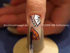 The clear nail lacquer protects the nail art
