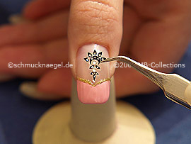 Nail sticker and the tweezers