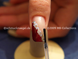 The clear nail lacquer protects the nail art