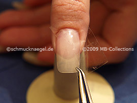 Clear adhesive tape and tweezers