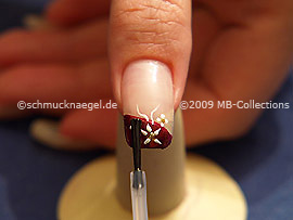 The clear nail lacquer protects the nail art