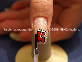 The clear nail lacquer protects the nail art