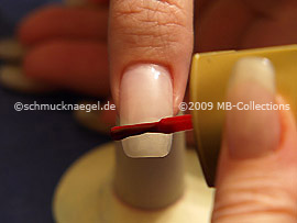 Nail lacquer in the colour red