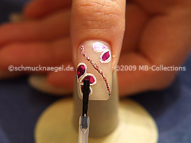 The clear nail lacquer protects the nail art