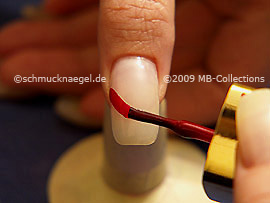 Nail lacquer in the colour dark red