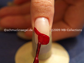 Nail lacquer in the colour dark red