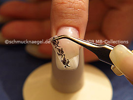 Nail-tattoo and tweezers