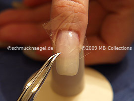 Clear adhesive tape and tweezers