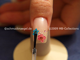 The clear nail lacquer protects the nail art