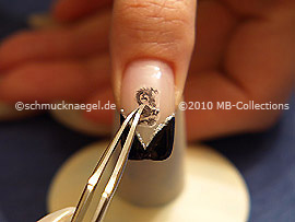 Dragon nail tattoo and tweezers