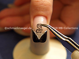 Dragon nail tattoo and tweezers