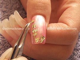 beaten gold and tweezers