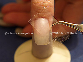 Clear adhesive tape and tweezers
