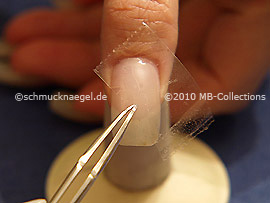 Clear adhesive tape and tweezers