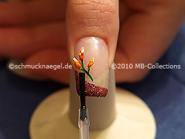 The clear nail lacquer protects the nail art
