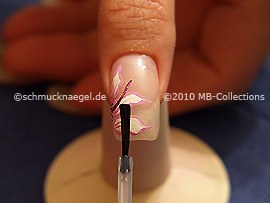 The clear nail lacquer protects the nail art