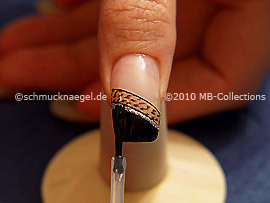 The clear nail lacquer protects the nail art