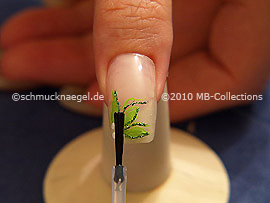 The clear nail lacquer protects the nail art