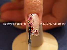 The clear nail lacquer protects the nail art