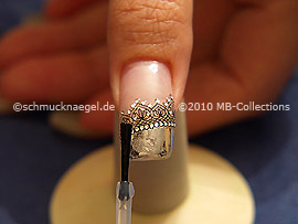 The clear nail lacquer protects the nail art