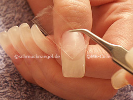 tweezers and clear adhesive tape