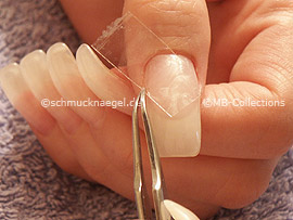 tweezers and clear adhesive tape