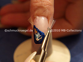 Tweezers and clear adhesive tape