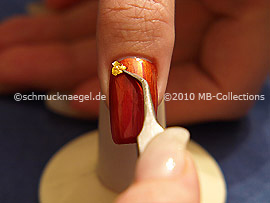 Beaten gold and the tweezers