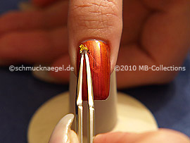 Beaten gold and the tweezers