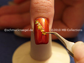 Beaten gold and the tweezers