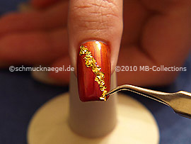 Beaten gold and the tweezers