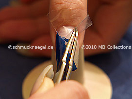 Tweezers and clear adhesive tape