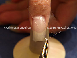 Clear adhesive tape and tweezers