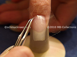 Clear adhesive tape and tweezers