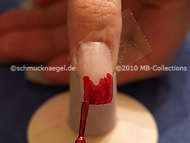 Nail lacquer in the colour dark red