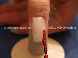 Nail lacquer in the colour dark red